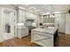 Gourmet kitchen features custom cabinets, a large center island with seating, and stainless steel appliances at 7305 Breeze Bay Rd, Cumming, GA 30041