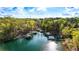 Beautiful lake with private boat docks, surrounded by lush trees at 7305 Breeze Bay Rd, Cumming, GA 30041
