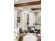 Modern living room revealing a concealed closet housing a washing machine behind elegant, painted doors at 7305 Breeze Bay Rd, Cumming, GA 30041