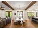 Spacious living area with dining, living, and kitchen areas featuring hardwood floors at 7305 Breeze Bay Rd, Cumming, GA 30041
