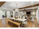Open-concept living space featuring dining area, fireplace, and hardwood floors at 7305 Breeze Bay Rd, Cumming, GA 30041