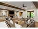 Comfortable living room with fireplace, wood beams, and plush seating arrangement at 7305 Breeze Bay Rd, Cumming, GA 30041