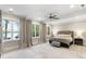 Bright main bedroom with large windows offering a scenic lake view at 7305 Breeze Bay Rd, Cumming, GA 30041