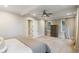 Relaxing main bedroom featuring neutral tones, and a ceiling fan at 7305 Breeze Bay Rd, Cumming, GA 30041