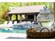 Inviting pool and cabana area with seating, perfect for relaxation and outdoor entertaining at 7305 Breeze Bay Rd, Cumming, GA 30041
