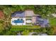A bird's-eye view highlights the pool, landscaped grounds, and unique roof at 808 Lullwater Ne Rd, Atlanta, GA 30307