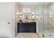 Stylish bathroom featuring marble tile, a vanity with elegant fixtures, and a glass-enclosed shower at 808 Lullwater Ne Rd, Atlanta, GA 30307