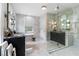 Luxury bathroom with marble tiling, modern fixtures, a stand-alone tub, and a glass shower at 808 Lullwater Ne Rd, Atlanta, GA 30307