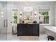 Elegant bathroom features a freestanding tub, marble tile, modern fixtures, and natural light at 808 Lullwater Ne Rd, Atlanta, GA 30307