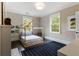 Stylish bedroom featuring a unique house frame bed, large windows and playful decor at 808 Lullwater Ne Rd, Atlanta, GA 30307