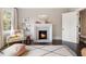 Cozy bedroom with a fireplace, chair, and stylish decor creates a warm and inviting atmosphere at 808 Lullwater Ne Rd, Atlanta, GA 30307