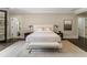 Spacious bedroom featuring a neutral color palette, plush bedding, and decorative lighting at 808 Lullwater Ne Rd, Atlanta, GA 30307