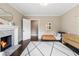 Bright bedroom with a fireplace, modern decor, and comfortable seating creates a relaxing and inviting space at 808 Lullwater Ne Rd, Atlanta, GA 30307