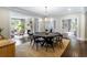 Open concept dining room with wood table and view into living room with fireplace at 808 Lullwater Ne Rd, Atlanta, GA 30307