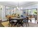 Dining room with dark wood table, large mirror, and view into bright living room at 808 Lullwater Ne Rd, Atlanta, GA 30307