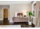 Stylish dresser with decor, a plant, and an open doorway, set against light beige walls at 808 Lullwater Ne Rd, Atlanta, GA 30307
