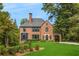Beautiful brick home with a charming portico and manicured lawn at 808 Lullwater Ne Rd, Atlanta, GA 30307