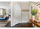 Entryway featuring hardwood floors, white trim, and view into formal living room at 808 Lullwater Ne Rd, Atlanta, GA 30307