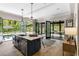 An elegant kitchen island sits next to an enclosed porch and offers backyard views at 808 Lullwater Ne Rd, Atlanta, GA 30307