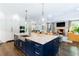Open kitchen flows to living room and features a large island with seating at 808 Lullwater Ne Rd, Atlanta, GA 30307