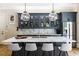 An elegant kitchen island boasts marble countertops, stylish pendant lighting, and a built-in bar at 808 Lullwater Ne Rd, Atlanta, GA 30307