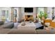 Open-concept living room with fireplace, hardwood floors, and view into other rooms at 808 Lullwater Ne Rd, Atlanta, GA 30307