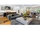 Open concept living room with marble countertops, kitchen island, and hardwood floors at 808 Lullwater Ne Rd, Atlanta, GA 30307