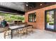 Outdoor kitchen and dining area features an outdoor kitchen, grill, dining table, and cozy chairs at 808 Lullwater Ne Rd, Atlanta, GA 30307