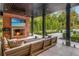 Relaxing outdoor space features a stone patio, outdoor fireplace, and lush landscaping perfect for entertaining at 808 Lullwater Ne Rd, Atlanta, GA 30307