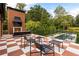 Enjoy outdoor living with an outdoor fireplace, pool, and plenty of seating for entertaining guests at 808 Lullwater Ne Rd, Atlanta, GA 30307
