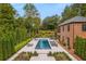 Gorgeous backyard featuring a stunning pool, patio, and lush landscaping at 808 Lullwater Ne Rd, Atlanta, GA 30307