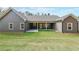 The home's exterior showcases a large backyard with a covered patio, ideal for outdoor entertaining at 82 Lexie Court, Rockmart, GA 30153