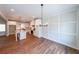 Open dining area flows into modern kitchen with stainless steel appliances and granite countertops at 82 Lexie Court, Rockmart, GA 30153