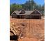 New home featuring a neutral color palette, roof, and an attached two-car garage, set on a generous lot at 82 Lexie Court, Rockmart, GA 30153