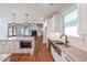 Modern kitchen featuring a center island and direct view into the living room at 82 Lexie Court, Rockmart, GA 30153