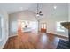 Open living room with hardwood floors flows into kitchen featuring center island at 82 Lexie Court, Rockmart, GA 30153