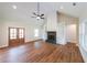 Bright living room features hardwood floors, vaulted ceilings, fireplace and exterior door at 82 Lexie Court, Rockmart, GA 30153