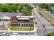 Aerial view showcasing outdoor dining, restaurants, and parking near the train at 118 Brighton Blvd, Woodstock, GA 30188