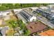 Bird's eye view of townhouses, businesses, and open land, showcasing the area's mix of residential and commercial spaces at 118 Brighton Blvd, Woodstock, GA 30188