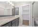 Bathroom offers a granite countertop and access to a walk-in closet at 118 Brighton Blvd, Woodstock, GA 30188
