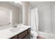 Well-lit bathroom features a large mirror, white subway tile, and modern fixtures at 118 Brighton Blvd, Woodstock, GA 30188