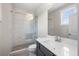 Bathroom featuring a glass shower, pebble flooring, and a vanity mirror at 118 Brighton Blvd, Woodstock, GA 30188