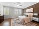Comfortable bedroom features a decorative rug and a wooden accent wall at 118 Brighton Blvd, Woodstock, GA 30188
