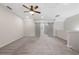 Large, bright bonus room with neutral walls, plush carpet, and unique sliding barn doors at 118 Brighton Blvd, Woodstock, GA 30188