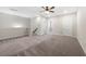 Spacious bonus room with plush carpeting, neutral paint, and access to additional rooms at 118 Brighton Blvd, Woodstock, GA 30188