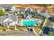 Aerial view of community pool with clubhouse, lounge chairs, and landscaped surroundings at 118 Brighton Blvd, Woodstock, GA 30188