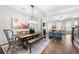 Inviting dining area with farm table adjacent to a bright, open living space at 118 Brighton Blvd, Woodstock, GA 30188