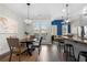 Dining area with views of a spacious living area and an outdoor patio at 118 Brighton Blvd, Woodstock, GA 30188