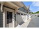 The townhome features a convenient attached garage with a driveway and an entryway with the house number 118 at 118 Brighton Blvd, Woodstock, GA 30188