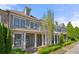Charming home featuring a well-manicured front yard, inviting front porch and traditional architectural details at 118 Brighton Blvd, Woodstock, GA 30188